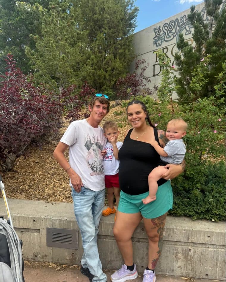 Kody Sanders, owner of Poudre Valley Pressure Washing, outdoors in Fort Collins with his family